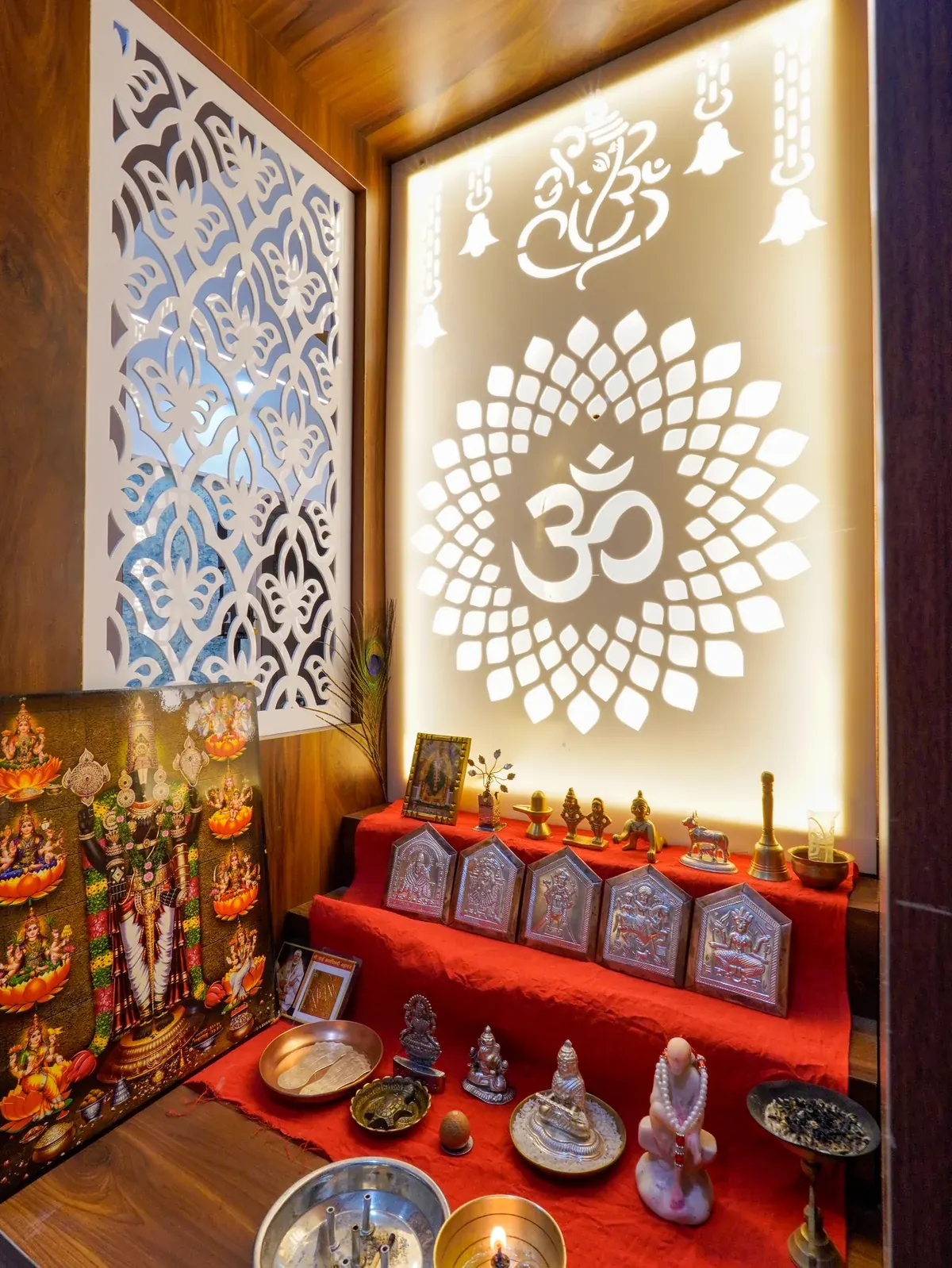 A close view of the illuminated prayer cabinet with decorative motifs and a patterned side panel.